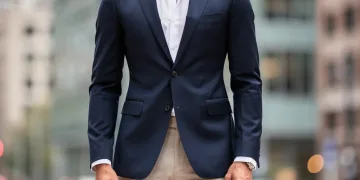 Man in perfectly tailored navy blazer, urban background