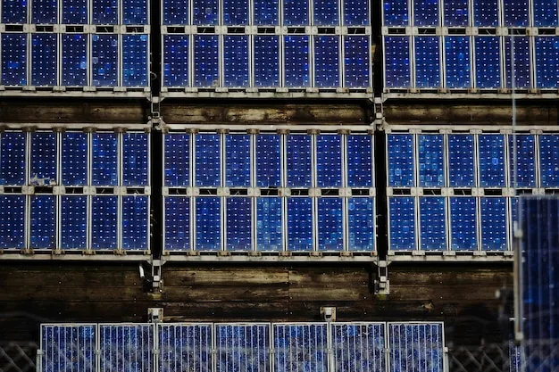 A close-up of a large-scale battery storage system connected to a solar power plant. The batteries are housed in a modern, climate-controlled facility. This underscores the importance of energy storage in the