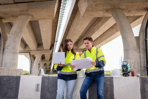 Construction workers collaborating on a bridge construction project in the USA, showing the job creation aspect of the US Infrastructure Bill: Tracking the First 100 Days of Project Implementation.