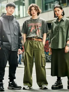 Diverse models display cutting-edge streetwear, oversized techwear, vintage tees, and gender-fluid styles in a vibrant urban landscape, embodying the 2026 fashion forecast.