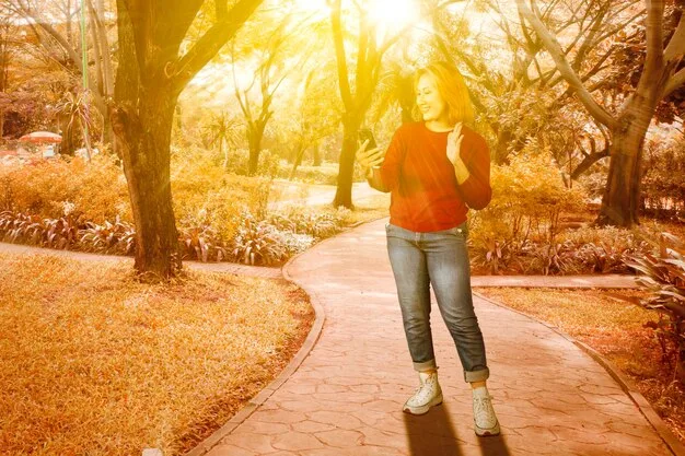 A person enjoying a walk outdoors on a sunny day, with a clear sky, highlighting the natural benefits of sunlight for vitamin D synthesis.