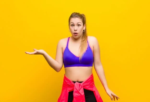 A woman with a pear body shape wearing a vibrant, detailed top that draws attention to her upper body, paired with dark, straight-leg trousers that skim gracefully over her hips and thighs. She looks confident and stylish.