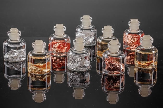 An elegant display featuring a selection of fragrance oils, each in a small glass vial with a dropper. These oils represent different scent families, showcasing the raw materials used in perfume creation.