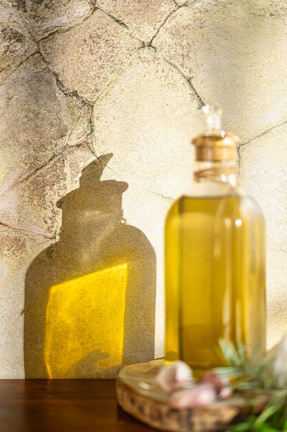 An artistic still-life photograph featuring three different niche fragrance bottles arranged on a textured concrete surface. The bottles are illuminated by a soft, diffused light, emphasizing their unique shapes and the subtle color variations in the perfume liquid within.