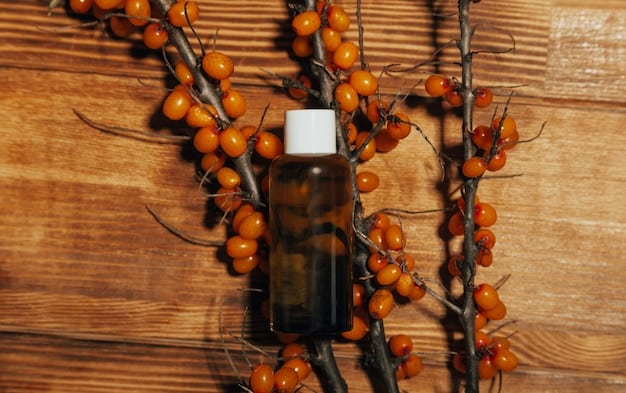 A neatly arranged selection of perfume ingredients on a wooden table, including citrus peels, amber resin, leather samples, and vanilla beans. The photo should convey a sense of craftsmanship and the art of perfumery. Soft natural light will enhance the textures and colors of the items.