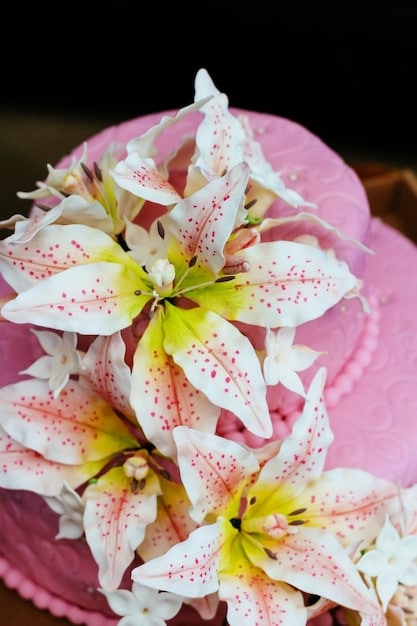 A close-up shot of various flowers used in perfumery, such as roses, jasmine, and lilies, arranged in a visually appealing manner. The image should highlight the textures and colors of the flowers, creating a sense of natural beauty and aroma.