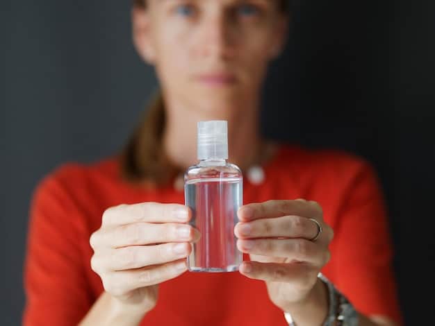A slightly frustrated person holding a perfume bottle, with a pile of other perfume bottles blurred in the background, suggesting a collection of unwanted fragrances.