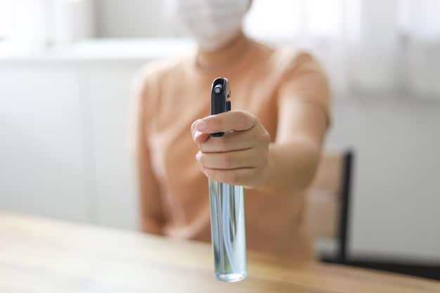 A close-up of a person spraying fragrance onto a test strip, with a variety of perfume bottles, both branded and clone, blurred in the background. Focus on the act of smelling the fragrance on the strip.