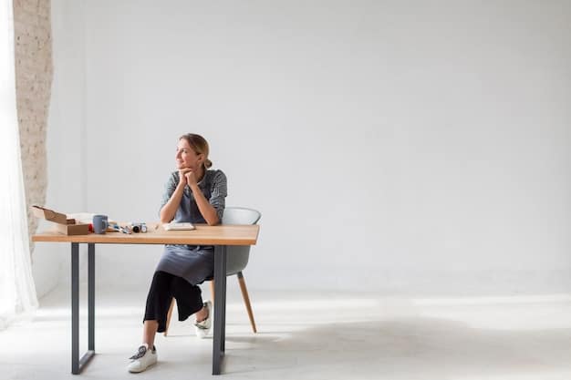 A modern, minimalist office setting with natural light. A person is sitting at a desk, working on a laptop, with a small, elegant bottle of perfume discreetly placed on the desk next to a notebook and pen. The color palette of the image is neutral and calming, with greens from a small plant adding a touch of nature. The focus is on the subtle integration of the fragrance into a professional environment.