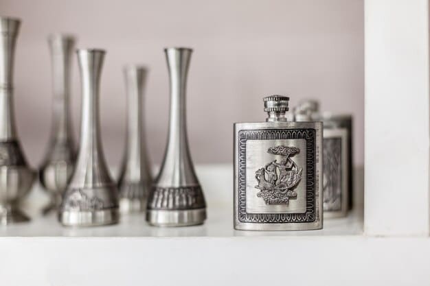 A close-up shot of various unisex fragrance bottles lined up on a modern, minimalist shelf in a boutique fragrance shop in the US. The bottles are diverse in design, showcasing different brands and scent profiles.