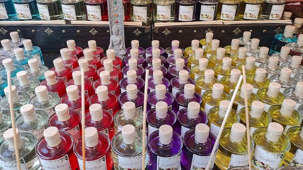A vibrant display of unisex fragrances from different brands in a US department store. The display includes eye-catching packaging and promotional materials, attracting potential customers to explore the diverse range of scents.