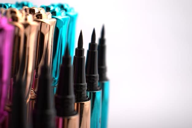A selection of different eyeliner products, including liquid eyeliner, gel eyeliner, and pencil eyeliner, along with an angled eyeliner brush and makeup remover wipes. The products are arranged neatly on a clean surface.