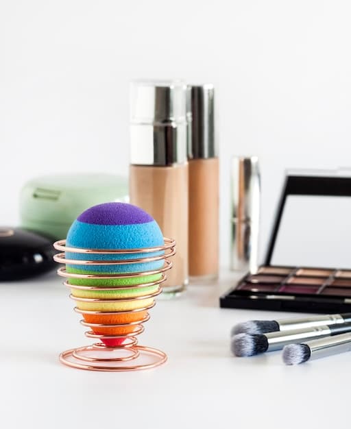 An assortment of color correcting products in different formulations – cream, liquid, and stick – displayed alongside makeup brushes and sponges, showcasing the range of options available.