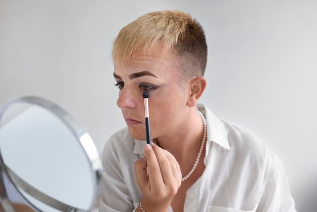 A woman applying eyeshadow to her eye with a makeup brush. Her hand is steady, and she is looking intently into a mirror. The focus is on the brush and the eyeshadow application technique being used.
