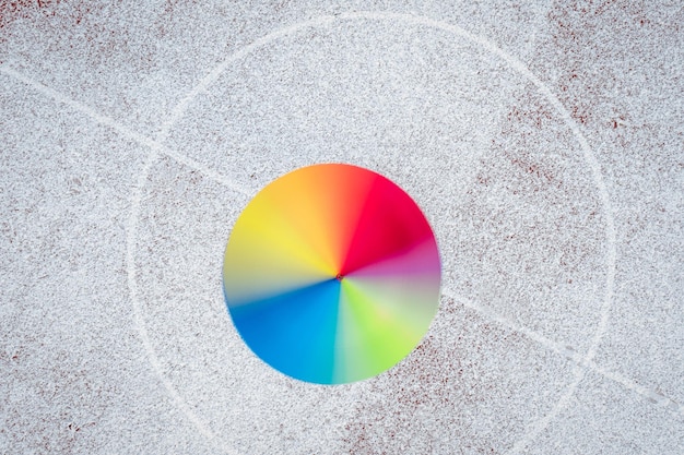 A close-up of a color wheel, with specific complementary color pairings highlighted. The image showcases the relationship between red and green, blue and orange, and yellow and purple, emphasizing how they neutralize each other.