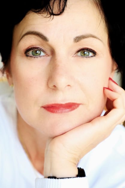 A close-up of a mature woman's face, showcasing properly shaped and filled-in eyebrows that enhance her features.