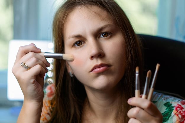 A woman testing various foundation shades on her jawline in natural light, with a clear view of the different undertones (warm, cool, neutral).