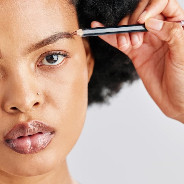 A close-up of perfectly shaped and filled eyebrows on a woman's face. Different brow products are displayed next to the face, showcasing the tools used for brow definition.