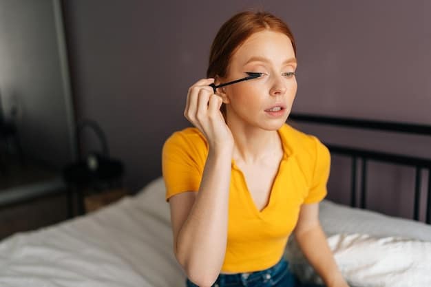 A woman curling her natural eyelashes with an eyelash curler, followed by applying a thin coat of mascara. The image shows a close-up of the eye to highlight the technique.