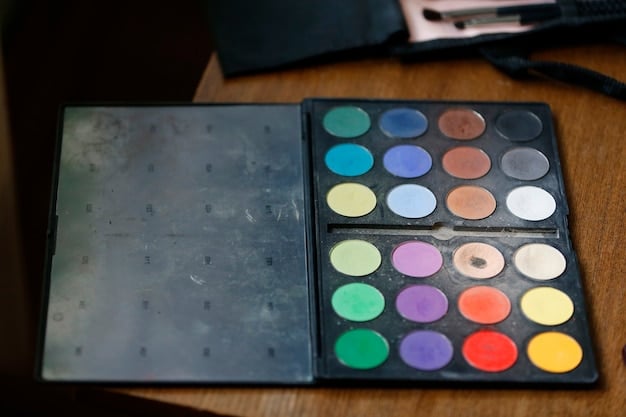 A close-up of a variety of colorful eyeshadow palettes, each open and displaying a range of shades from pastel pinks and blues to vibrant purples and greens. The palettes are arranged on a clean, white surface with soft, natural lighting.