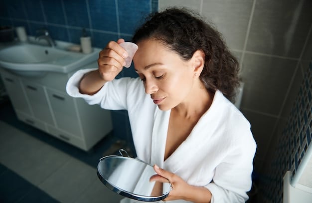 A woman gently removing her false eyelashes with a cotton swab soaked in makeup remover, demonstrating the correct technique for safe and effective removal.