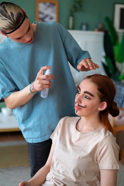 A woman spraying setting spray onto her face, eyes closed, with a soft smile. The spray bottle is held at arm’s length, ensuring even distribution over her makeup.