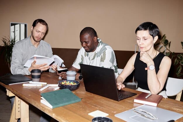 A diverse group of people, appearing concerned and thoughtful, gathered around a table reviewing documents and discussing financial implications, symbolizing the broad impact of tax changes.