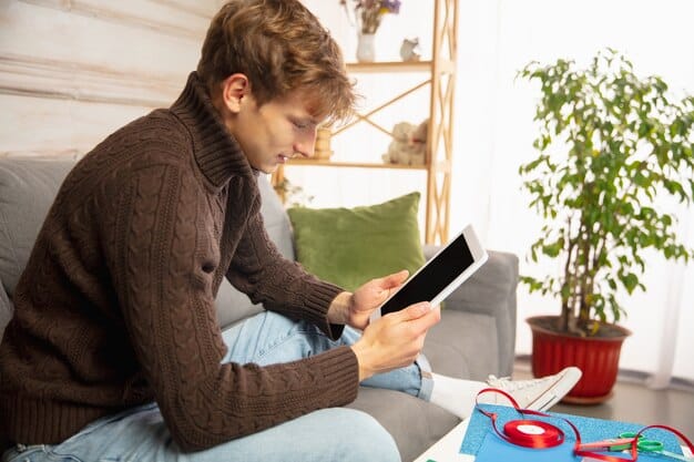 A person looking thoughtfully at a tablet displaying health insurance options, symbolizing personal choice and informed decision-making in healthcare.