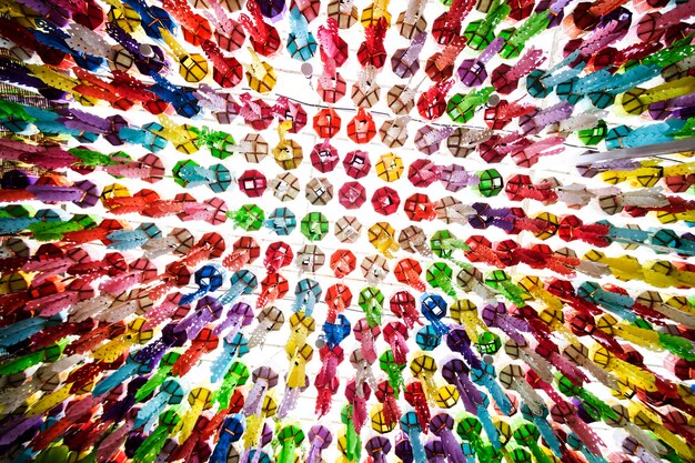 A dynamic image illustrating collaboration, with hands of diverse individuals interlocking and a mosaic of global flags in the background, symbolizing international partnership and shared responsibility in combating climate change.