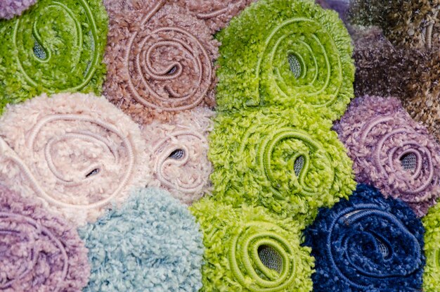 A flat lay of various patterned scarves and textured fabrics (e.g., faux fur, corduroy), illustrating how to subtly incorporate trending prints and textures.