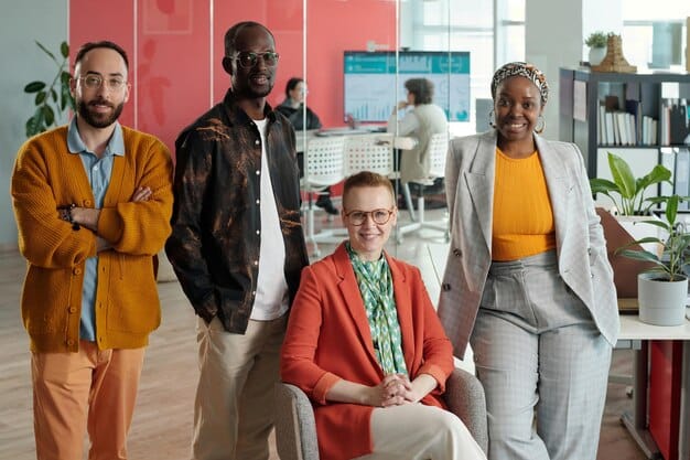A diverse group of professionals in a modern office, each dressed in a style that reflects their individual role and personality, but collectively conveying a sense of competence and collaboration.