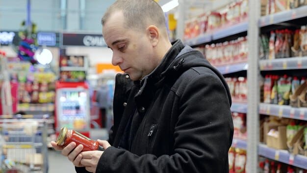 A distraught person looking at an empty wallet, with grocery store items in the background, symbolizing the struggle with rising living costs.