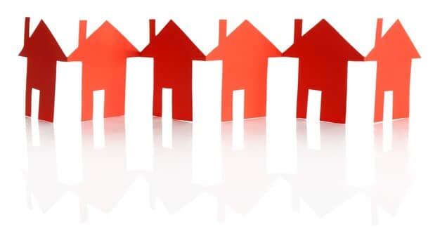 An abstract image symbolizing financial growth and real estate, possibly a stylized house with arrows pointing up and down representing market fluctuations, surrounded by various financial symbols like dollar signs and charts. Should convey both movement and the economic aspect.