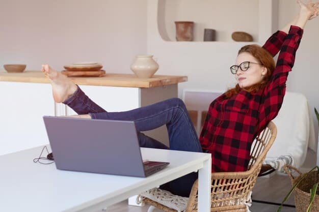 A person sitting comfortably in a home office, typing on a laptop, with a happy expression, surrounded by a productive yet relaxed environment.