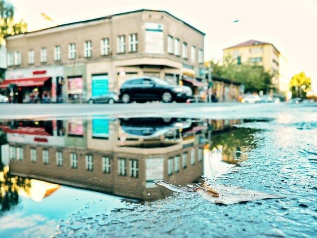 A coastal town's main street during a severe flood, with businesses closed and vehicles submerged, illustrating the economic devastation of coastal climate impacts.