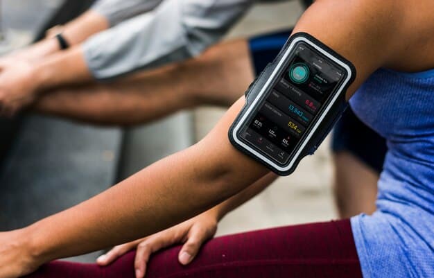 A person wearing a continuous glucose monitor (CGM) device on their arm, with a smartphone displaying real-time glucose graphs, symbolizing modern technology in diabetes management.