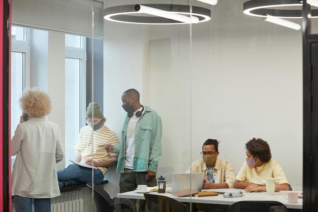 A diverse group of people working together in a modern office space, representing the collaborative nature of the modern workforce. Focus on What Does the Latest US Jobs Report Reveal About Economic Recovery?