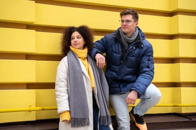 A man and a woman wearing different types of knitwear in a business casual setting. The man is wearing a v-neck sweater over a button-down shirt, and the woman is wearing a cardigan over a blouse. Both are paired with dress pants and loafers. The image showcases the comfort and style of The Ultimate 2025 Guide to Business Casual: 7 Key Pieces Every Professional Needs.