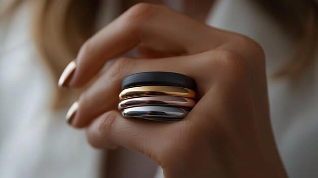 A detailed shot showcasing various ring styles (stacking rings, statement ring, minimalist band) on a hand, highlighting how they can be combined and styled to create different looks. This image is intended to inspire creativity in accessorizing and is directly related to The Ultimate Guide to Jewelry: Choosing the Right Pieces for Every Outfit.