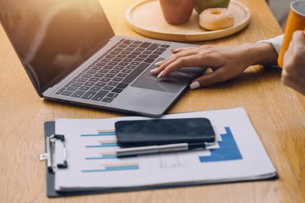 A person reviewing various insurance plan options on a laptop, with comparison charts and financial calculators visible.