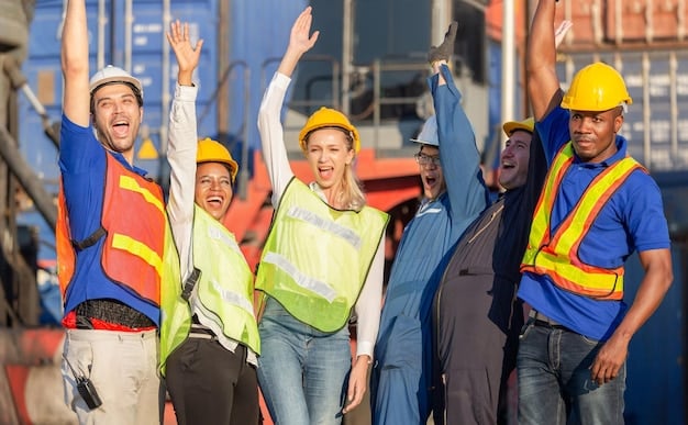 A diverse team of construction workers wearing hard hats and safety vests actively working on a bridge construction site with heavy machinery in the background under a clear sky.