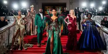 Celebrities in avant-garde fashion ascending the grand staircase at the 2026 Met Gala.
