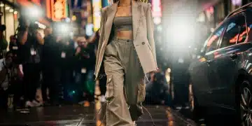 Celebrity in oversized deconstructed blazer and cargo pants, embodying spring 2026 streetwear