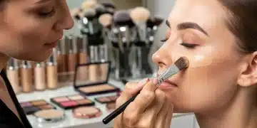 Professional makeup artist applying foundation for long-lasting wear in US climates
